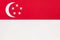 Singapore national fabric flag, textile background. Symbol of international asian world country