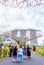SINGAPORE - NOVEMBER 11, 2018: Tourists on the background of Building Marina Bay Sands. Vertical