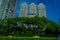 SINGAPORE, SINGAPORE - FEBRUARY 01, 2018: Outdoor view of appartments buildings in Singapore behind of bunch of trees