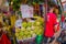 SINGAPORE, SINGAPORE - JANUARY 30. 2018: Outdoor view of unidentified man selling durian fruit in a street market, the