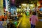 SINGAPORE, SINGAPORE - JANUARY 30. 2018: Outdoor view of unidentified peopleeating in the street Bugis market, Singapore