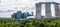 Singapore skyline panorama with green trees and plants, modern skyscrapers and Marina Bay Sands luxury hotel