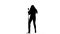 Singer performs her song of authorship. White background. Silhouette. Slow motion