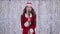 Singer in a snow maiden costume sings songs in a retro microphone. Bokeh background. Slow motion