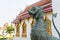 Singha or the lion statue in front of Thai temple
