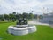 Singha sculpture at Ruen Yod Barom Mungkalanusaranee pavilion under bright blue sky