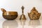 Singing bowl,  Figurine Cheerful Hotei  and golden bell close-up, soothing and meditative. Singing bowl with sanskrit engraving