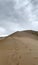 The singing dune in the Aktau mountain range at the Altyn Emel National Park panel, Kazakhstan