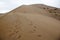 The singing dune in the Aktau mountain range at the Altyn Emel National Park panel, Kazakhstan