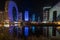 Singing light and music fountain on background of panorama of beautiful buildings at night