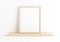 Single 8x10 Vertical Wooden Frame mockup on wooden shelf and white wall