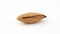 Single almond nut in a shell. Slowly rotating on the turntable isolated on the white background. Macro.