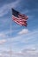 Single American Flag with Cloudy Sky