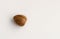 Single avocado seed on a white background