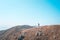 Single backpack hiker standing on highland of a mountain