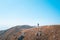 Single backpack hiker standing on highland of a mountain