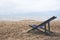 A single beach chair by the sea