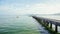 Single boat driving next to a pier Thailand