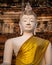 Single Buddha statue inside Wat Yai Chai Mongkhon, a Buddhist temple of archaeological park,