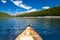 A single canoe on a mountain lake