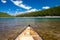 A single canoe on a mountain lake