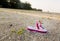 Single child flipflop on empty beach