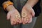 A single child opening her hands with wooden letters forming the word No