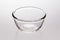 Single clear glass bowl, light gray background