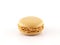 single coffee flavored macaron (macaroon) isolated on white background