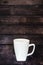 Single coffee mug on a wooden table background - java espresso with copy space