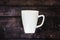 Single coffee mug on a wooden table background - java espresso with copy space