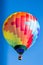 Single colorful hot air balloon in flight