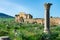 A Single Column and the Arch of Caracalla at the Roman Ruins of Volubilis in Morocco