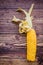 Single curly drying corn cob on dark wooden background flat lay top view