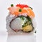 Single delicious salmon uramaki roll over isolated white background