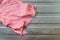 Single dirty wet pink dishcloth on steel. Concept for unhealthy and germs growth