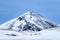 Single dramatic symetrical volcanic,snow covered cone near lake Myvatn, Iceland in mid winter