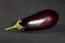 Single eggplant on black