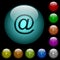 Single email symbol icons in color illuminated glass buttons