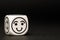 Single emoticon dice with happy expression sketch