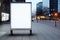 A single empty billboard stands on a dimly lit city street, ready to showcase advertisements to passing viewers, Vertical blank