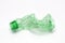 Single empty green plastic bottle on white background. Waste recycling concept. Garbage. Isolation on white.