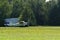 Single engine Cessna plane on grassy runway