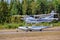 Single-engined piston-powered aircraft with fixed landing gear Cessna T206H Turbo Stationair OH-PAX amphio floats landing on