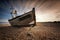 Single fishing boat stranded on pebbled beach. Dungeness, England
