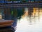 Single fishing-rod on city pond background