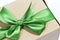 Single gift box with green ribbon