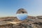 single glas sphere ball hovering in the air in large empty desert environment abstract surreal concept 3D Illustration