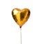 Single gold big heart metallic balloon for birthday isolated