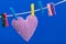 Single heart on clothesline with clothespins